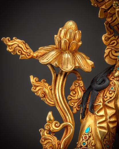Detailed shot of blooming lotus seat beneath Green Tara with carved patterns
