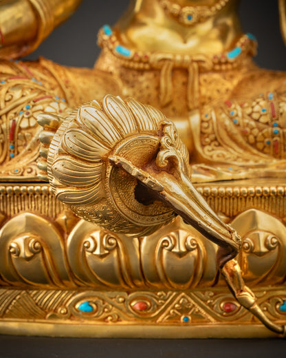 Detailed shot of blooming lotus seat beneath Green Tara with carved patterns
