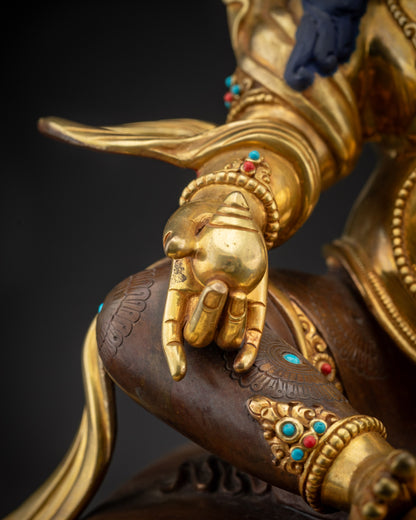 Detailed shot of citron fruit held by Dzambhala statue symbolizing abundance