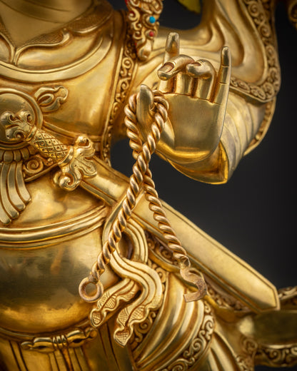 Detailed shot of lasso held by Nechung Chuyong Statue representing power of Dharma