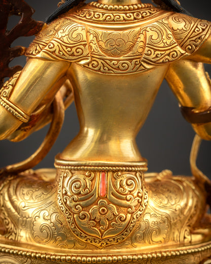 Detailed shot of lower robe of Maha Manjushri statue showing folds and semi-precious stone inlay
