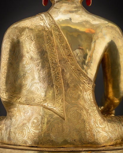 Detailed shot of monk’s robe carved patterns on Buddha Shakyamuni statue