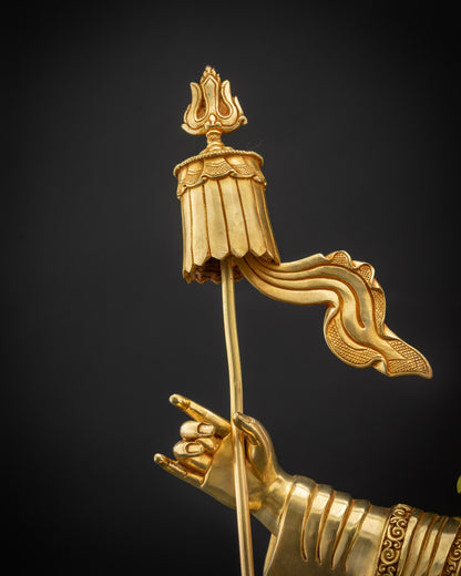 Detailed shot of parasol banner and trident triple prong in Nechung Chuyong Statue