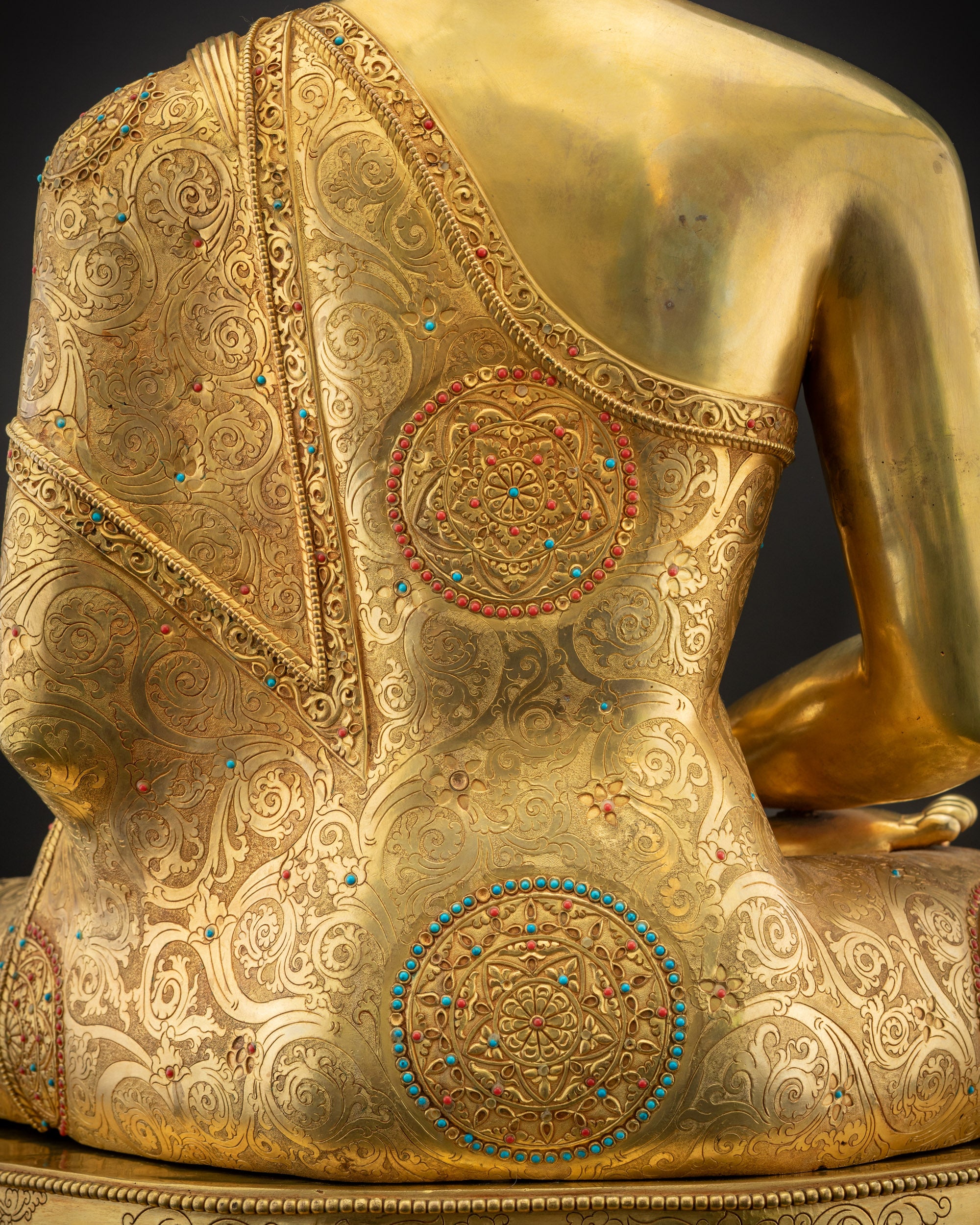 Detailed shot of robe Amitabha Buddha gold-gilded handcrafted monk’s robe
