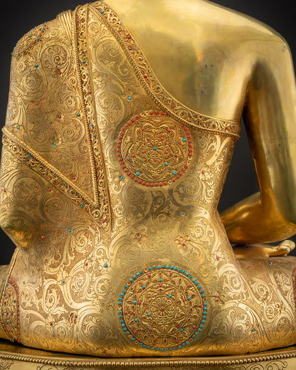 Detailed shot of robe Amitabha Buddha gold-gilded handcrafted monk’s robe
