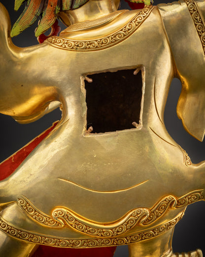 Detailed shot of robe and semi-precious stones on Nechung Chuyong Statue