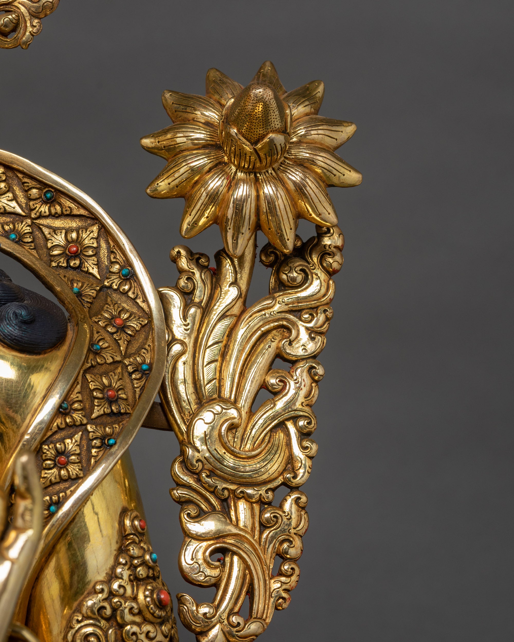 Detailed shot of utpala flower on Gold Fire-Gilded Green Tara Statue

