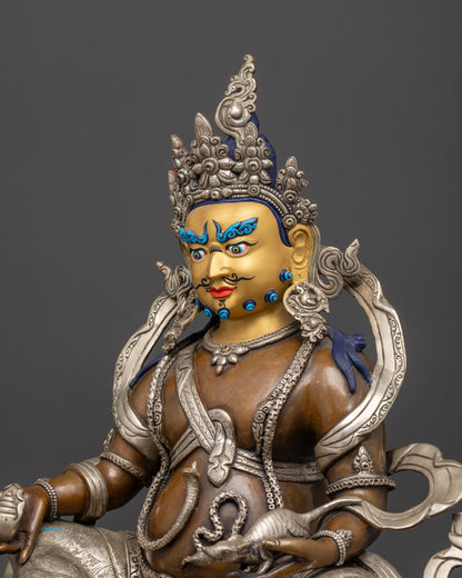 Detailed side Dzambhala statue showing silver-plated garments, intricate carvings, jewelry
