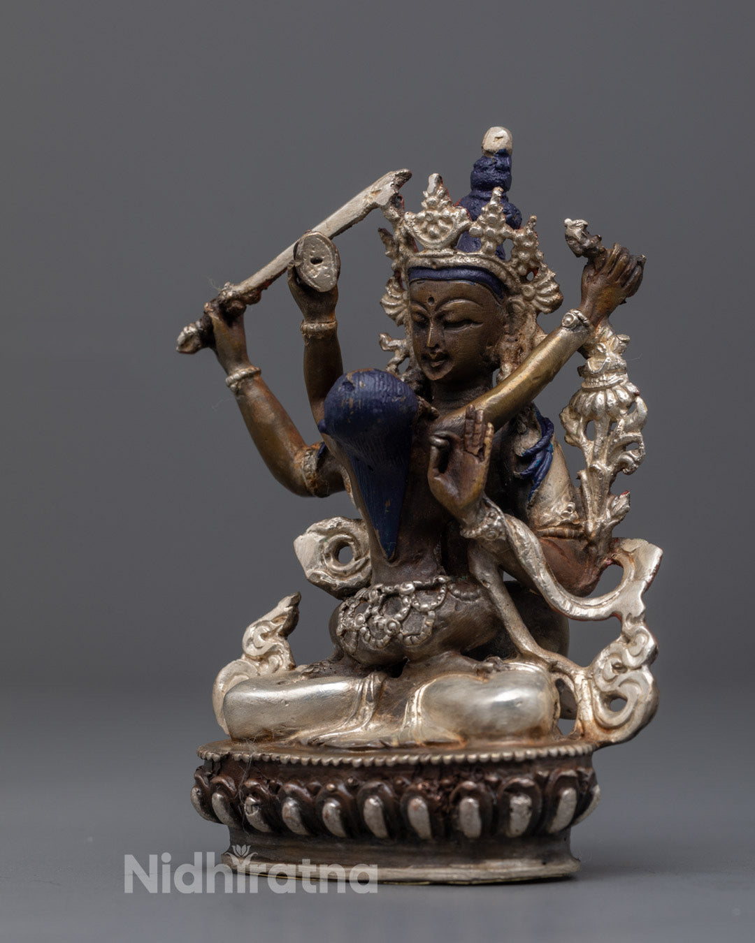 Manjushri with Consort sculpture showing intricate carvings and symbolic Buddhist iconography