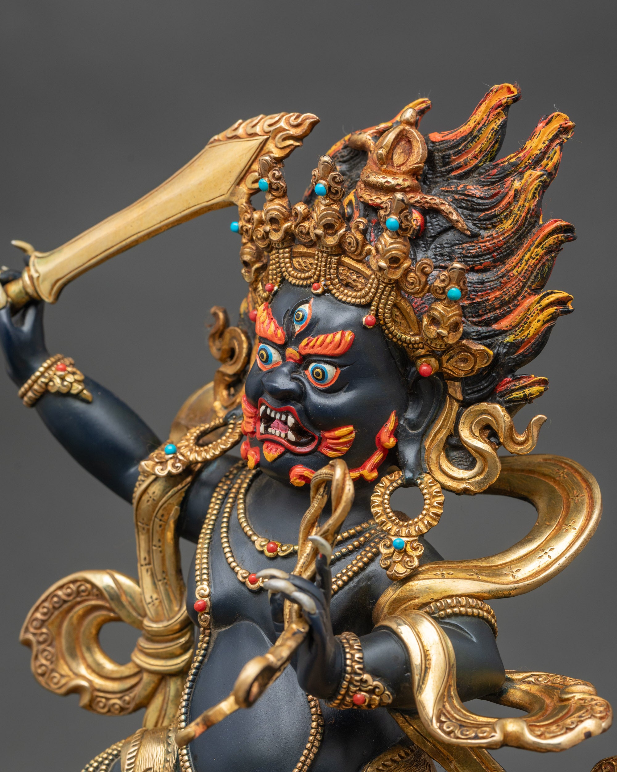 Detailed side close-up of Achala Statue displaying five-skull crown and flowing robes