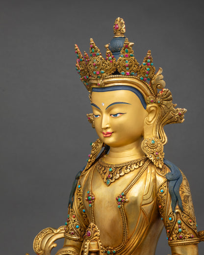 Detailed side close-up of Amitayus holding long-life vase, gold fire-gilded copper