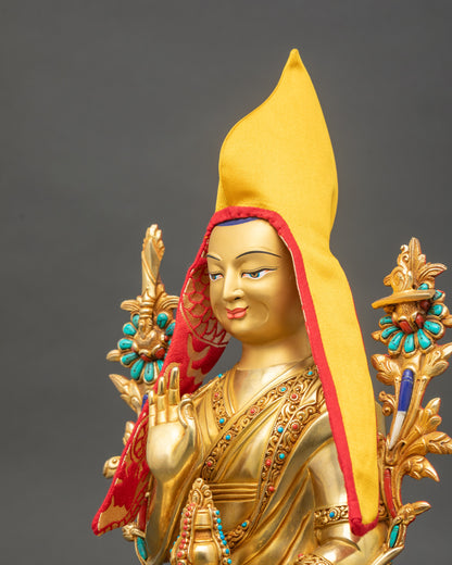 Detailed side close-up of Je Tsongkhapa statue highlighting ornate utpala lotus stems and flaming sword of wisdom