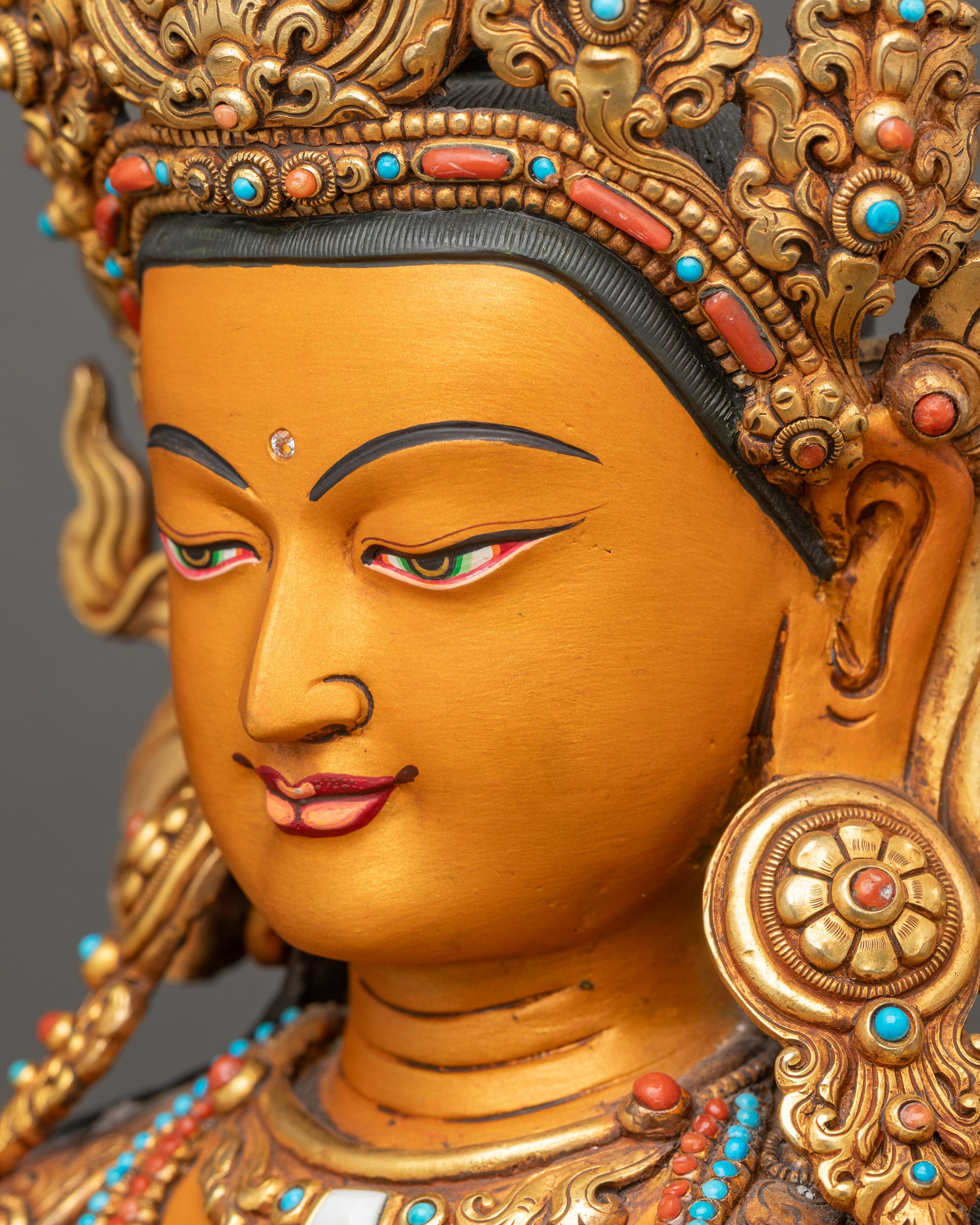 Detailed side close-up of Manjushri face highlighting peaceful expression and fine details