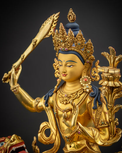 Detailed side close-up of Manjushri statue highlighting flaming sword and utpala flower details
