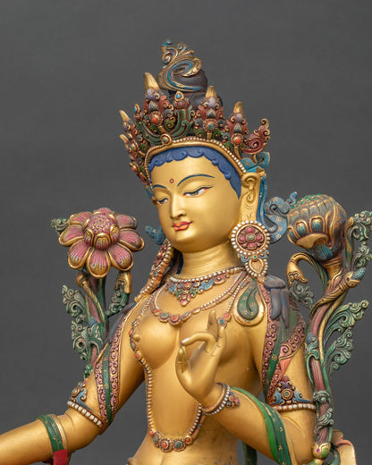 Detailed side close-up of Shyama Tara holding utpala stem with blooming flower