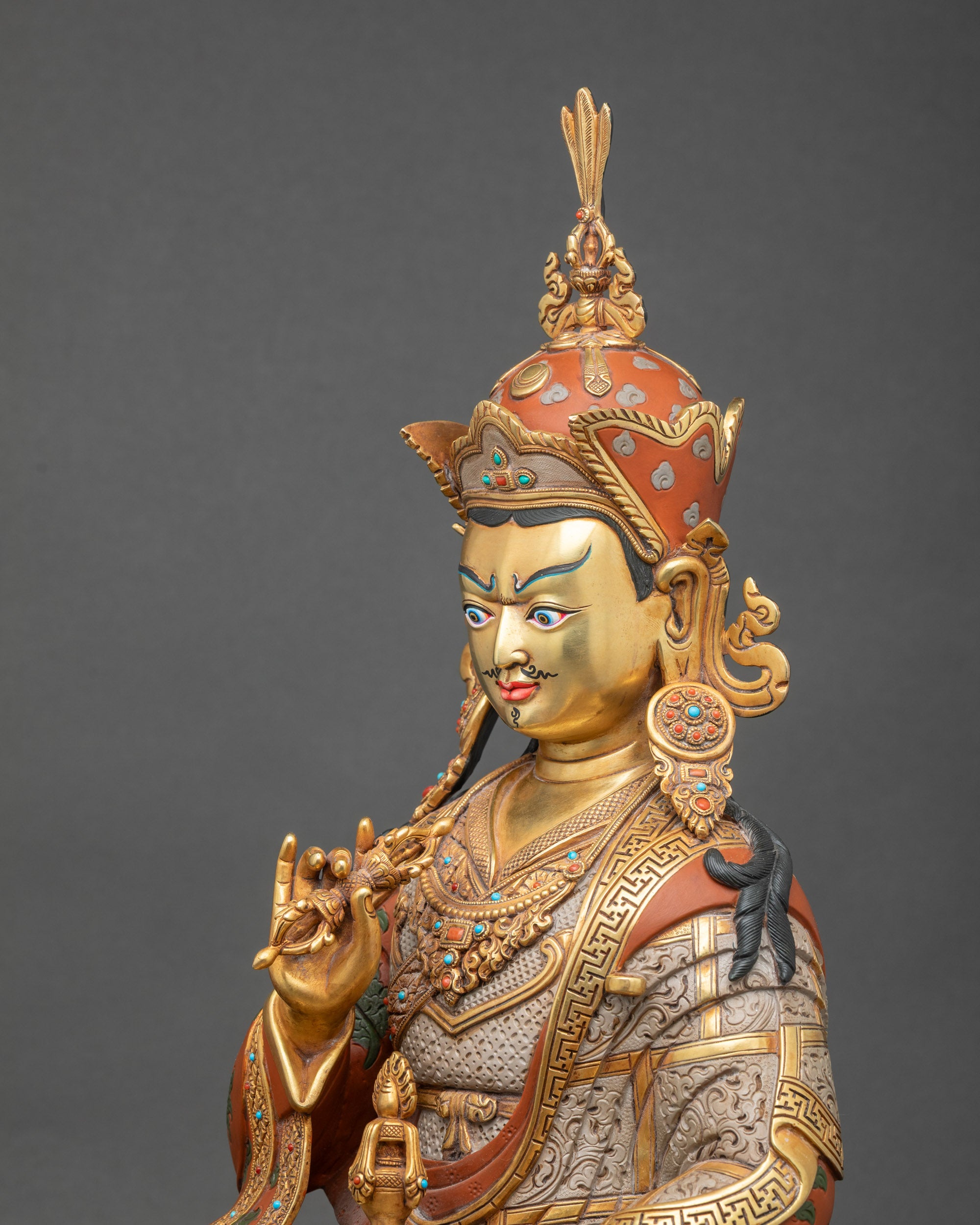 Detailed side close-up of Tsokye Dorje statue with ornate robe details