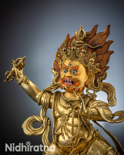 Vajrapani statue gold-gilded face with fierce expression and flaming hair
