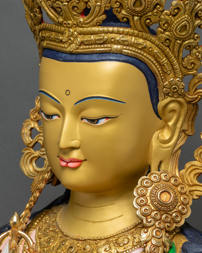 Detailed side close-up of Vajrasattva face highlighting gold-painted features and expression