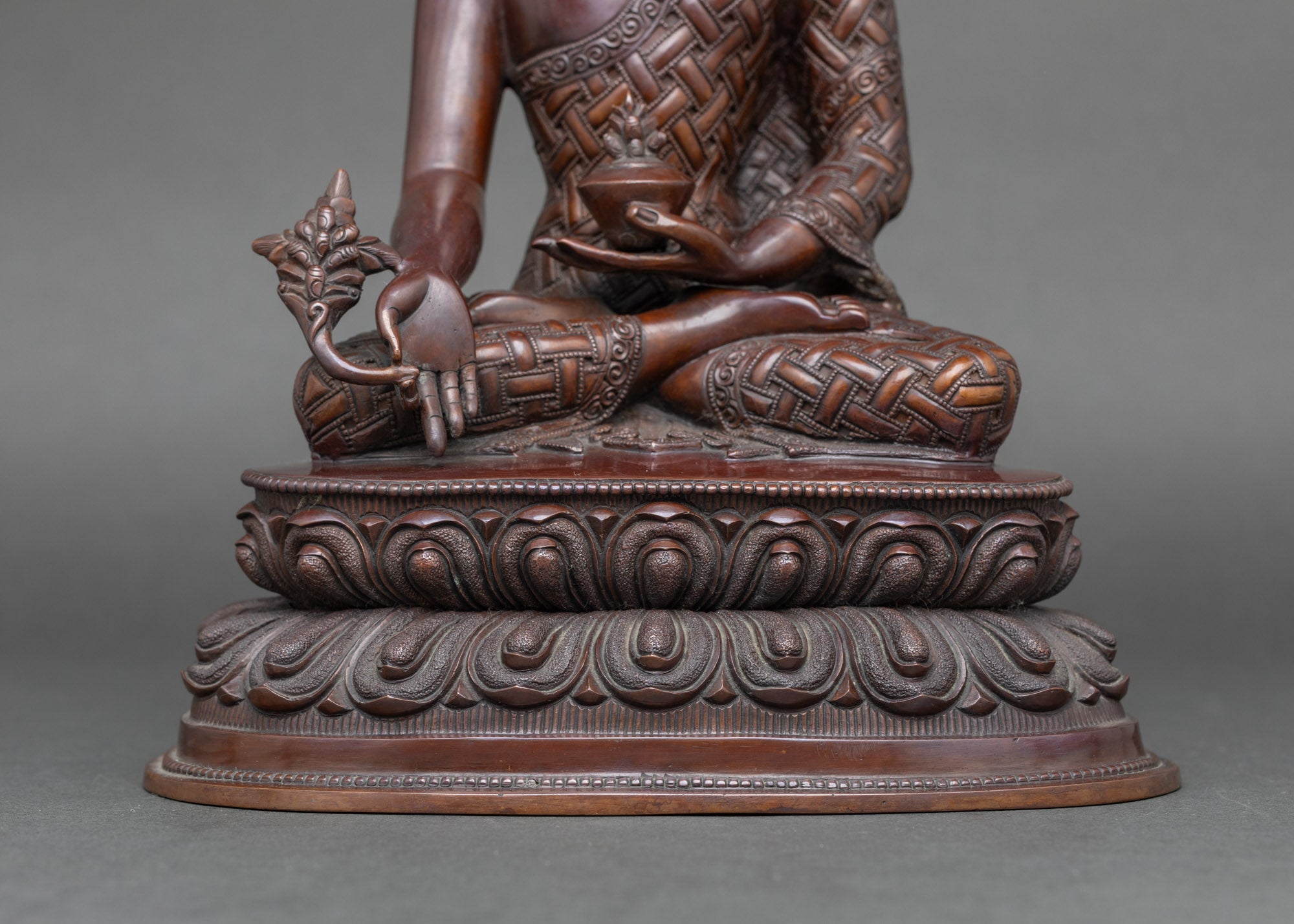 Detailed side close-up of lotus seat Medicine Buddha, handcrafted for meditation