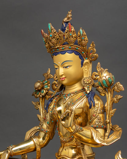 Detailed side close up Green Tara Bodhisattva sculpture semi-precious stones and robes detail