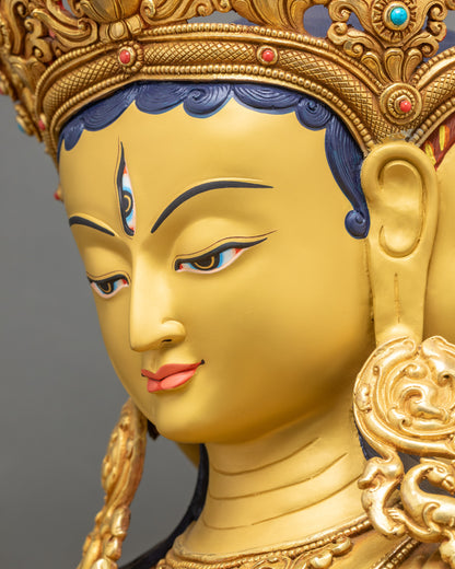Detailed side close up Namgyalma face with gold gilding and serene Vajrayana expression