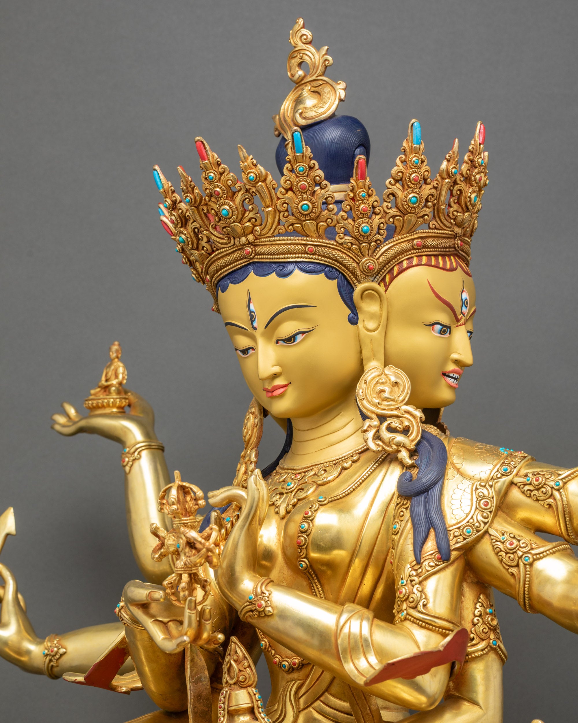 Detailed side close up Namgyalma statue highlighting carved ornaments and sacred implements