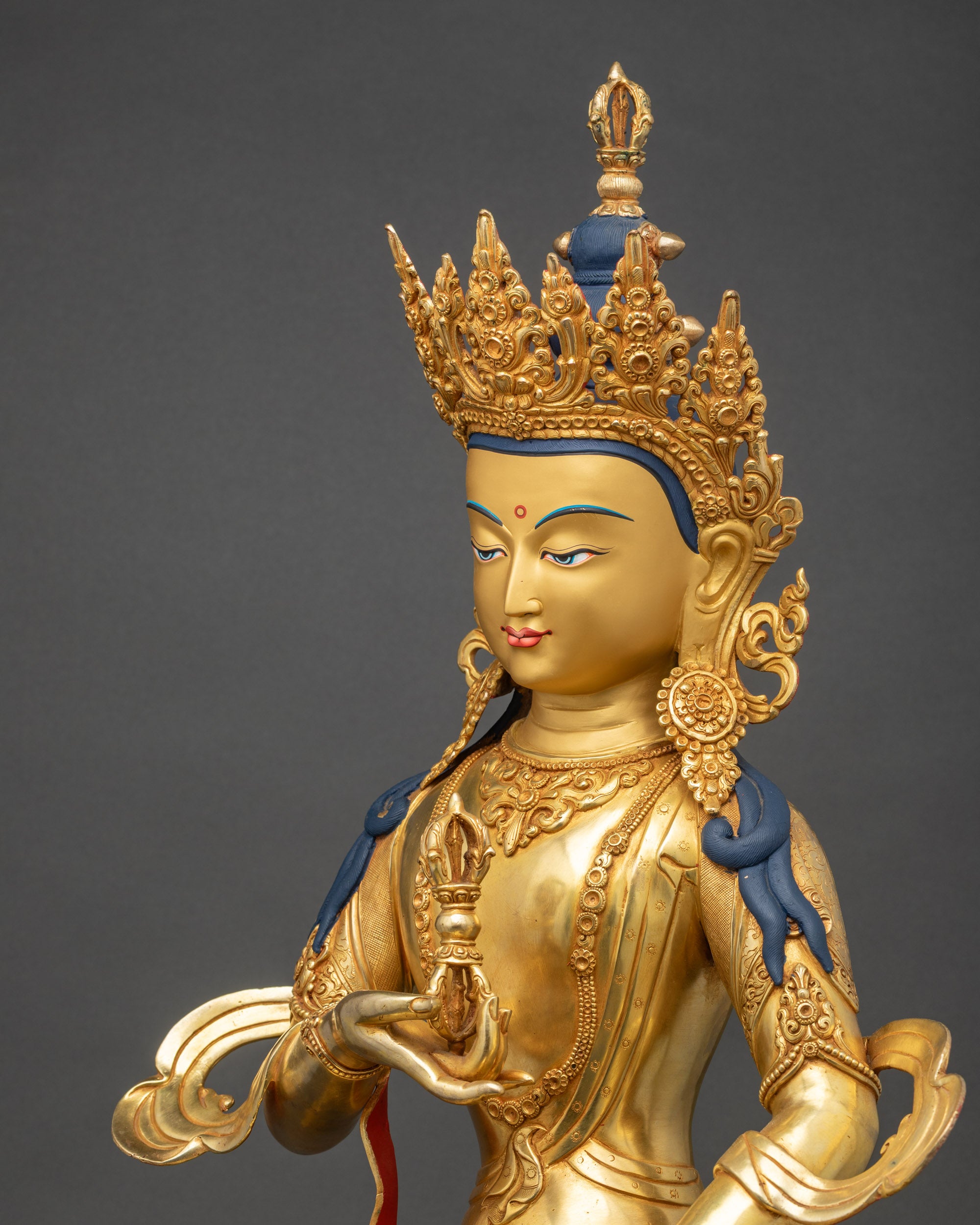Detailed side close up Vajrasattva Statue side view carved robe and semi-precious stones