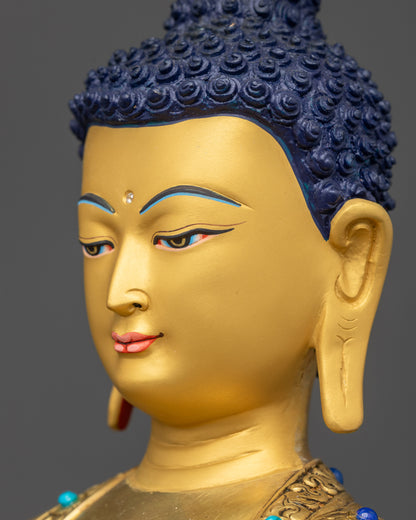 Detailed side close up face Amitabha Buddha gold-gilded copper calm serene face