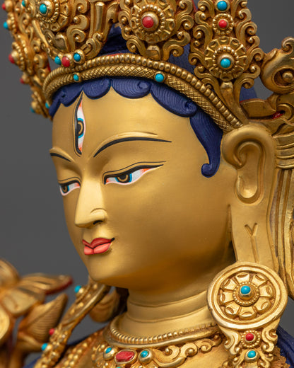 Detailed side close up face White Tara Statue with serene gold-gilded facial features
