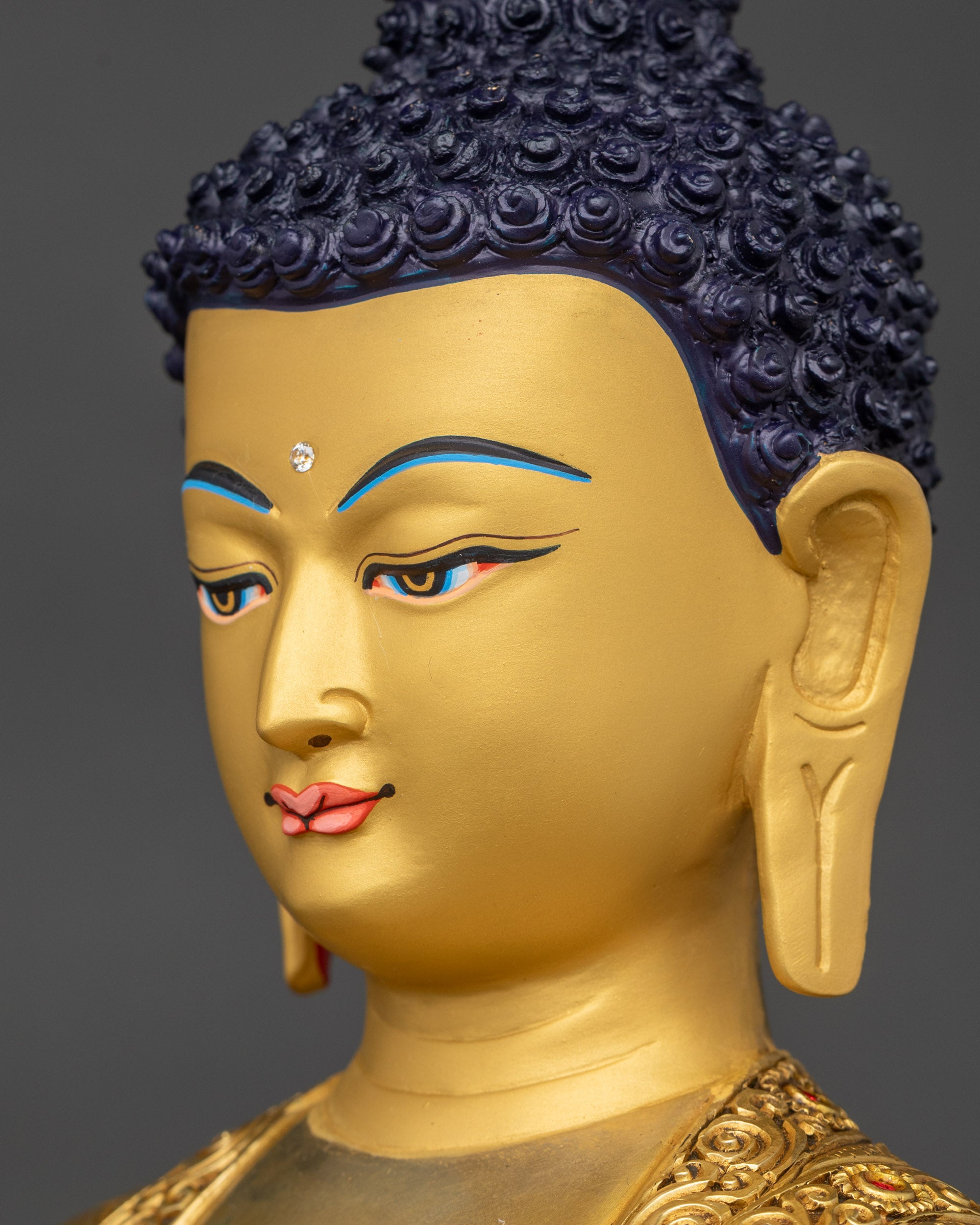 Detailed side close up face of Amitabha Buddha, gold-painted serene expression visible