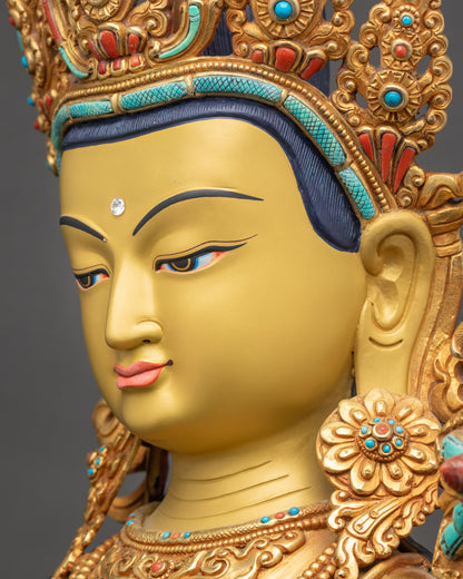 Detailed side close up face of Padmapani statue with tranquil gold-gilded expression