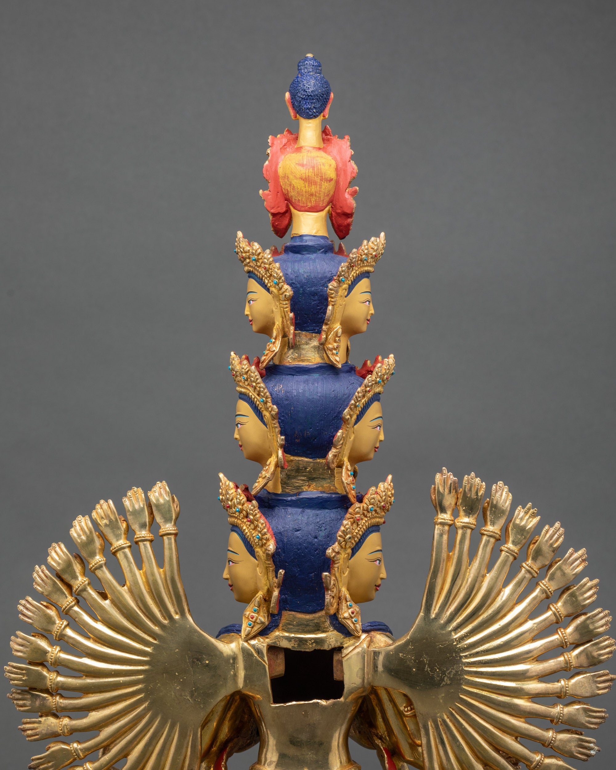 Detailed side close up face showing peaceful expression and wish-fulfilling jewel of Chenrezig
