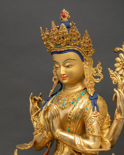 Detailed side close up of Chenrezig sculpture showing four arms and ornate robes