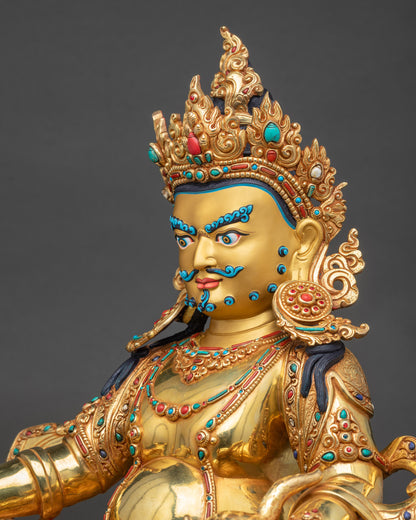 Detailed side close up of Dzambhala statue highlighting layered gold gilding and carvings
