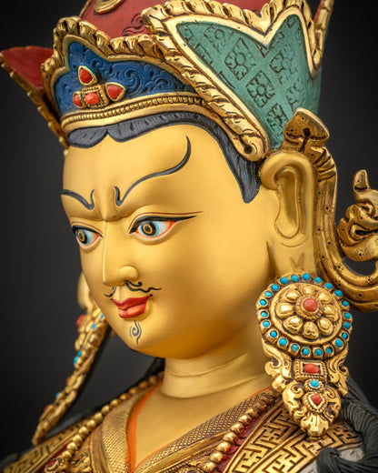 Detailed side close up of Guru Rinpoche face with gold fire-gilded semi-wrathful expression