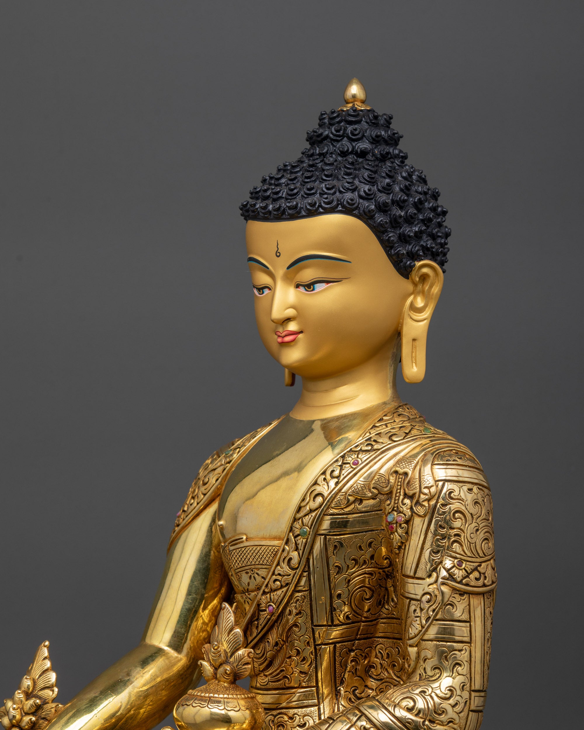 Detailed side close up of Medicine Buddha showing flowing Himalayan-style robes
