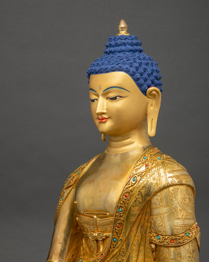 Detailed side close up of Shakyamuni Buddha Sculpture showing gold-painted face and robes