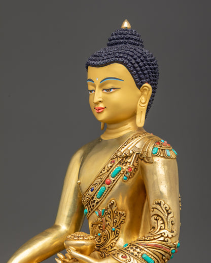 Detailed side close up of Shakyamuni Buddha statue showing carved feather floral robe design