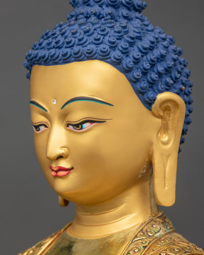 Detailed side close up of the face Side profile of gold fire gilded Amitabha Buddha with peaceful meditative gaze