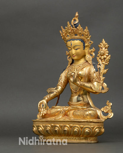 Detailed side face of White Tara deity sculpture highlighting vigilant compassionate eyes