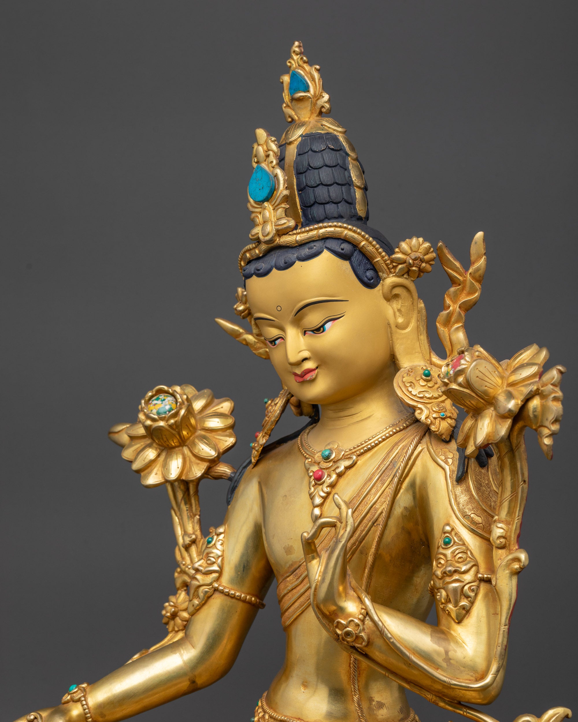 Detailed side view Green Tara Statue showing Varada mudra and Vitarka mudra hands
