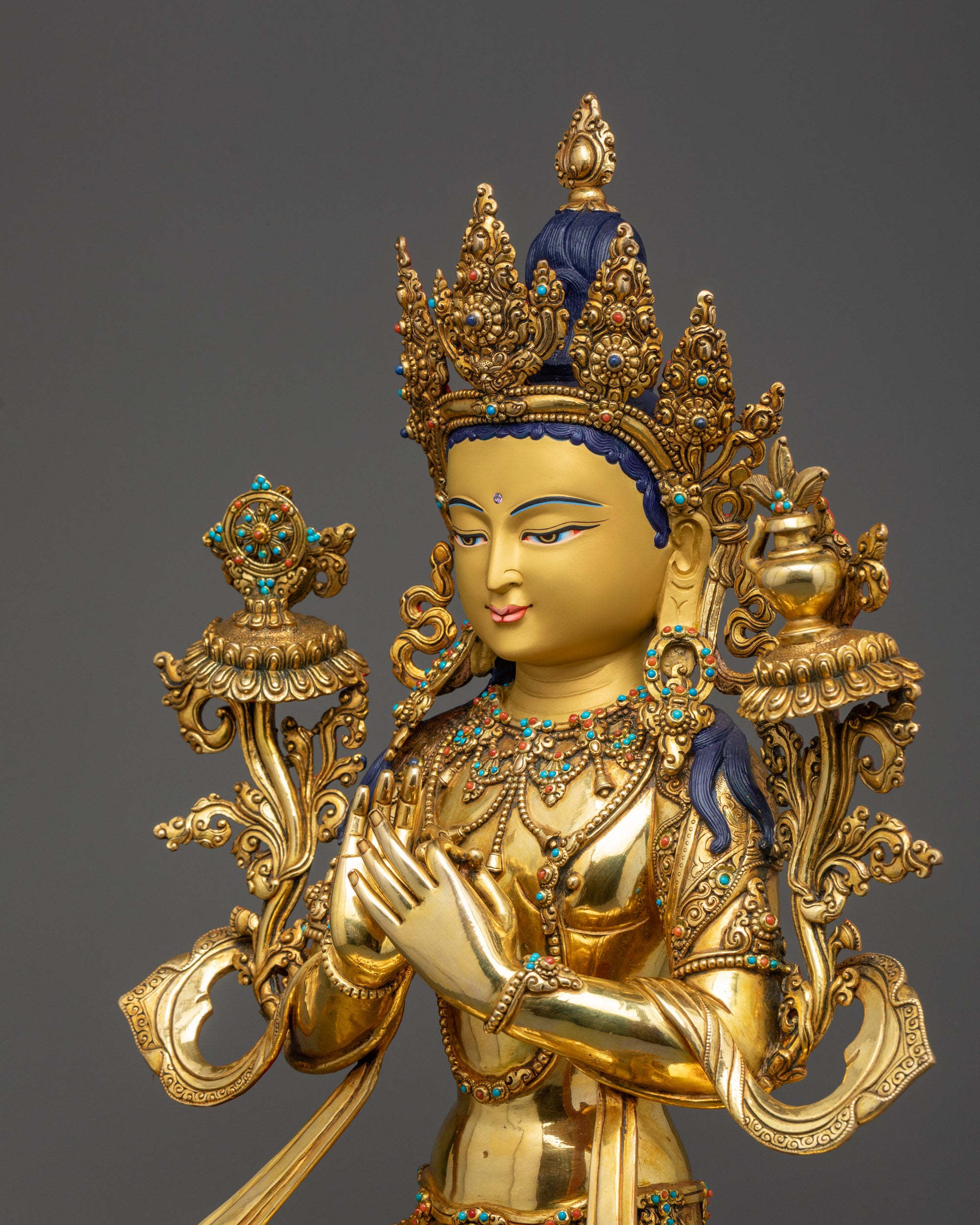 Detailed side view Maitreya Buddha showing flowing robe and dharmachakra hand gesture