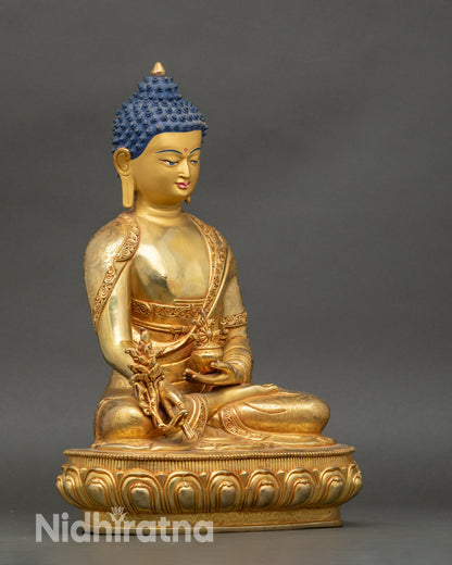 Detailed side view of Bhaisajyaguru statue with floral monk garments on lotus seat