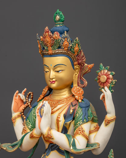 Detailed side view of Chenrezig sculpture showing carved swirling robes and patterns
