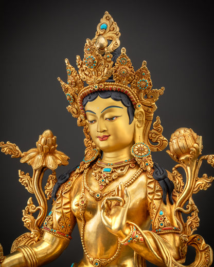 Detailed side view of Green Tara statue showing intricate filigree and floral motifs
