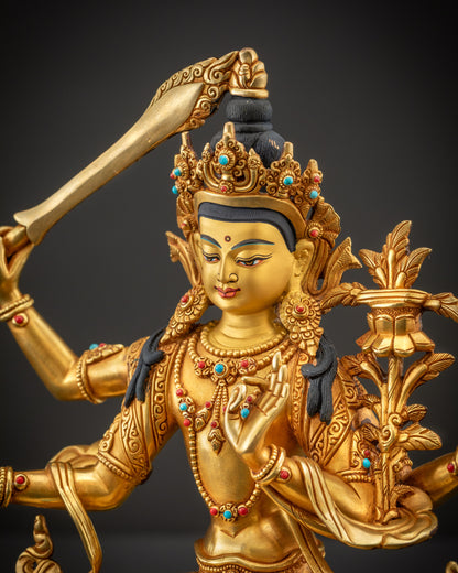 Detailed side view of Maha Manjushri statue capturing robe folds, jewelry, and arm positions
