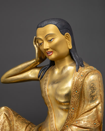 Detailed side view of Milarepa statue highlighting carved garments and gemstones
