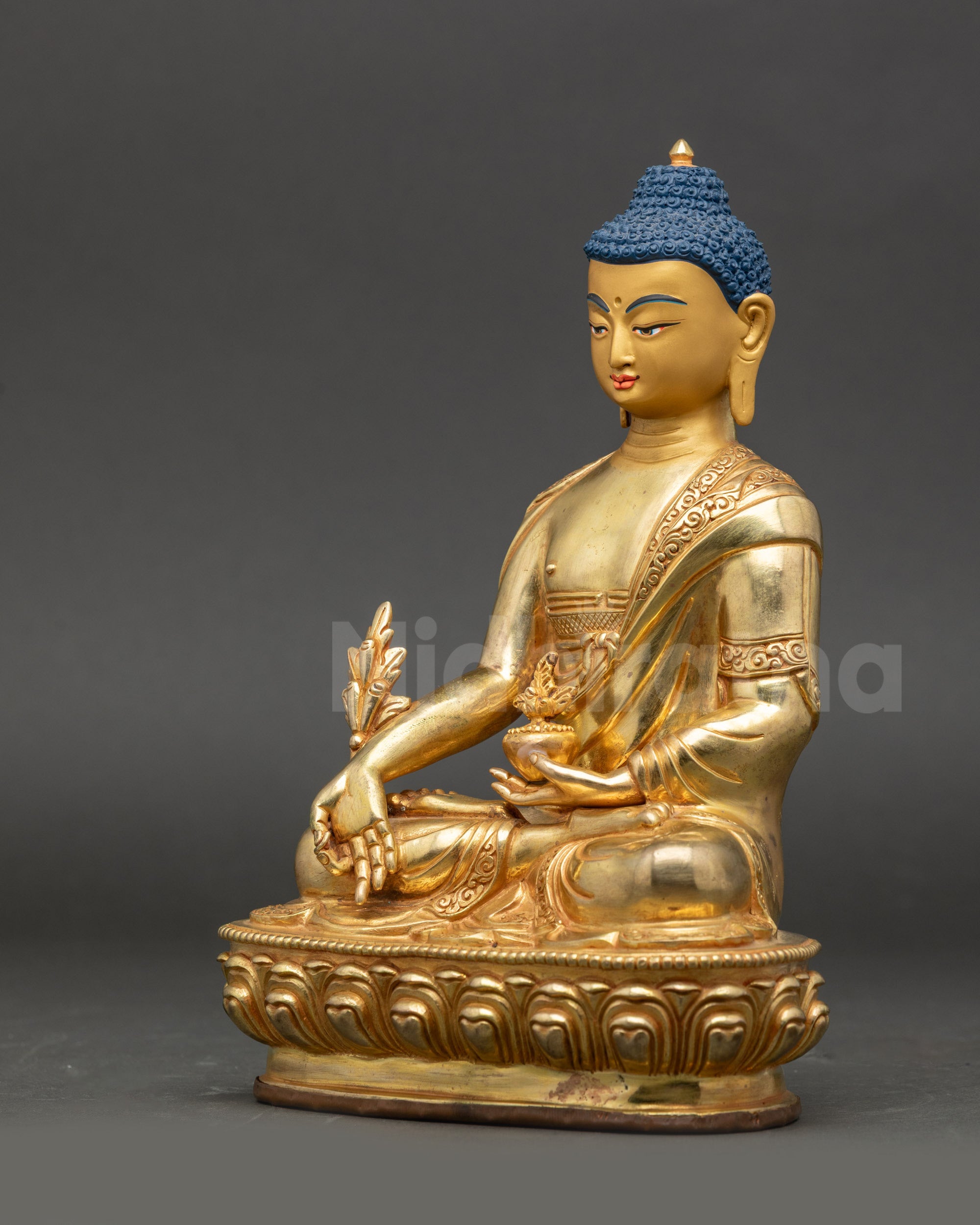 Detailed side view of Nepalese copper Medicine Buddha holding healing nectar bowl