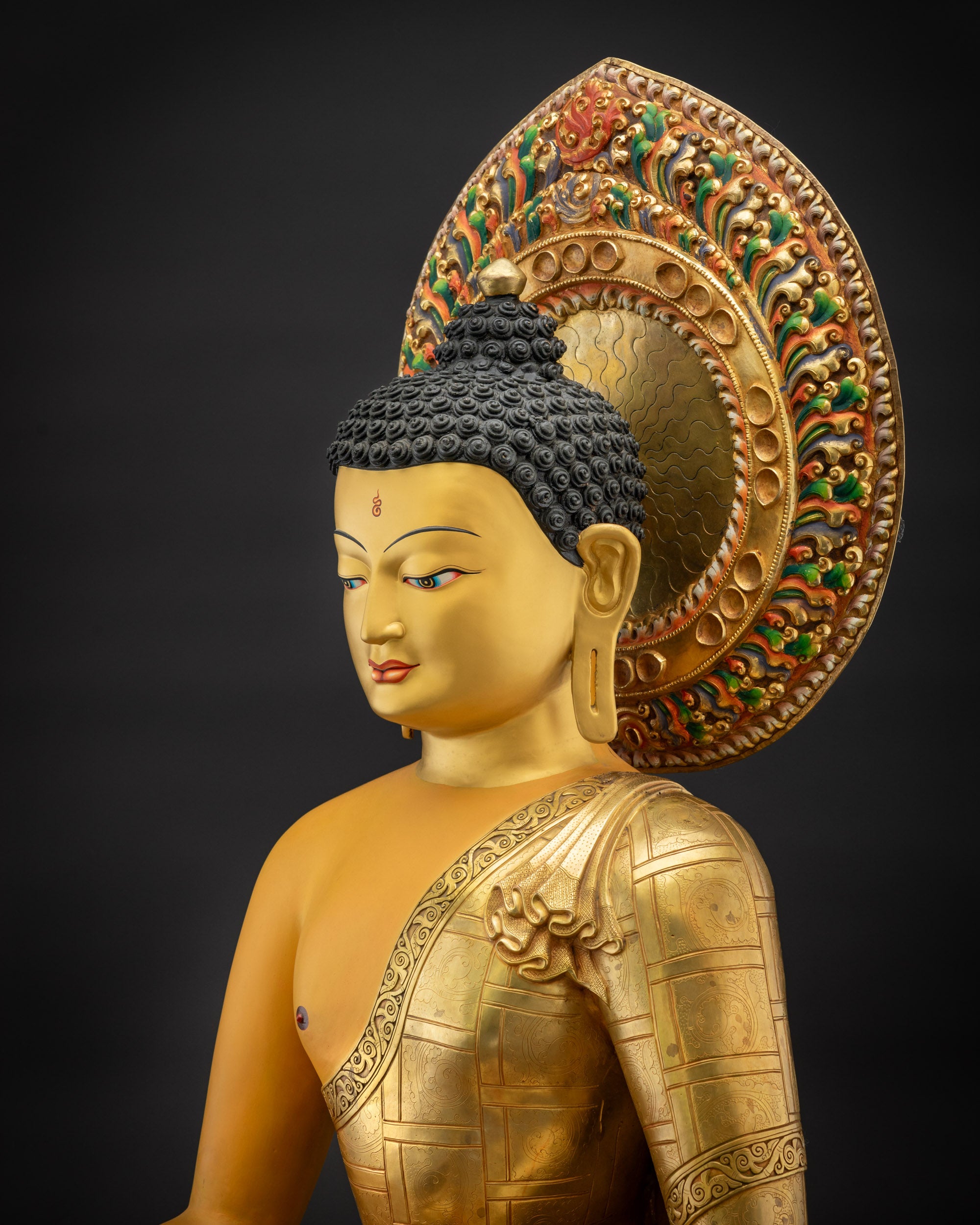 Detailed side view of Shakyamuni Buddha Siddhartha Gautama robe folds fire gold
