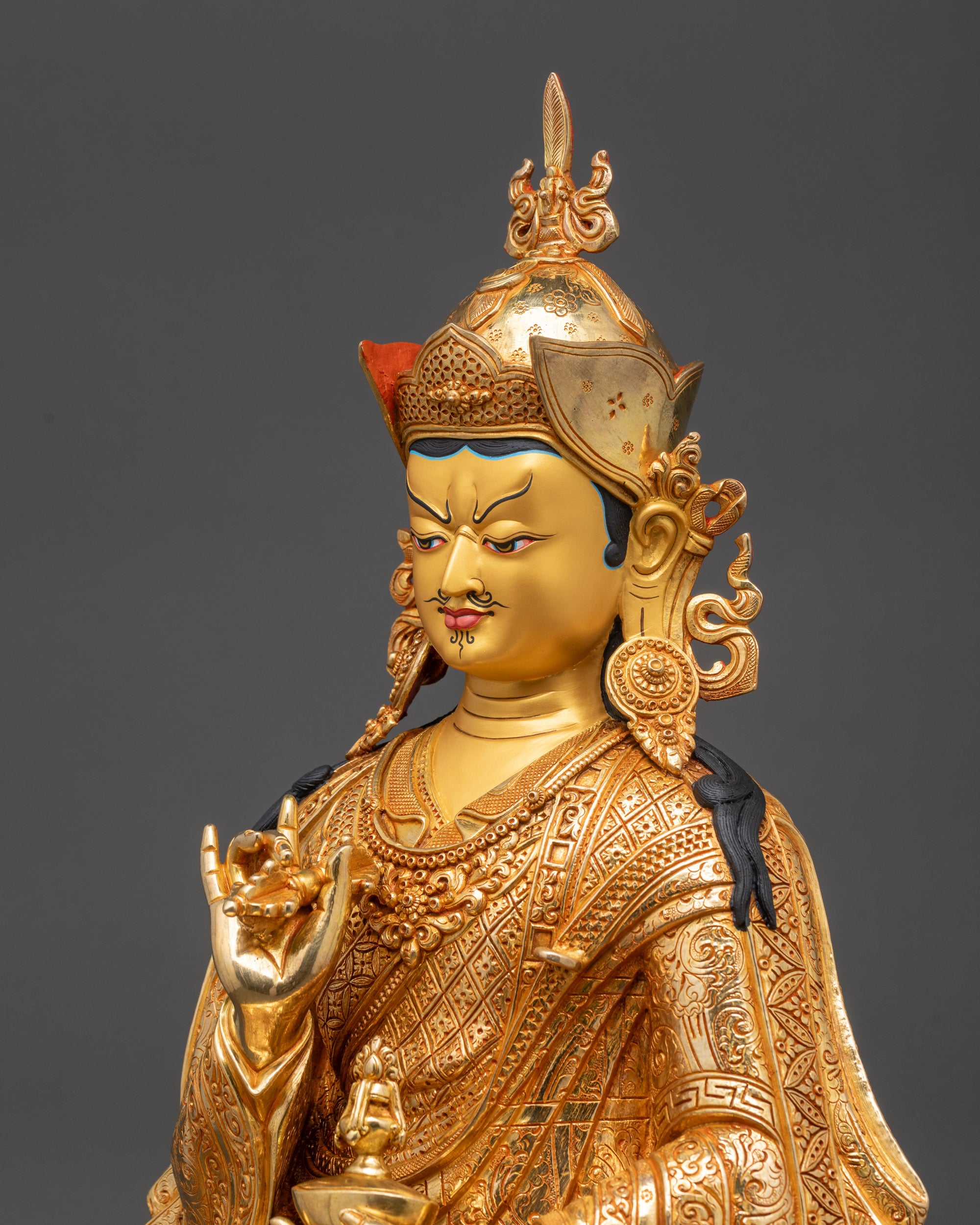 Detailed side view of Tsokye Dorje Statue with dorje and skull cup
